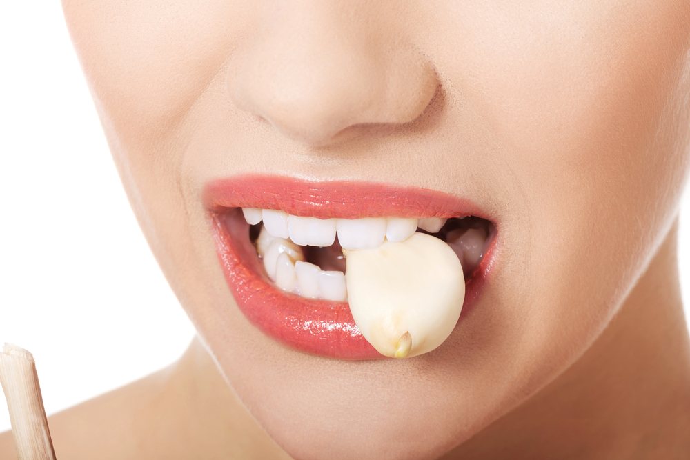 sonhar que come alho